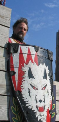 image of Sir Osric in armor at Pennsic in the fort pallisade